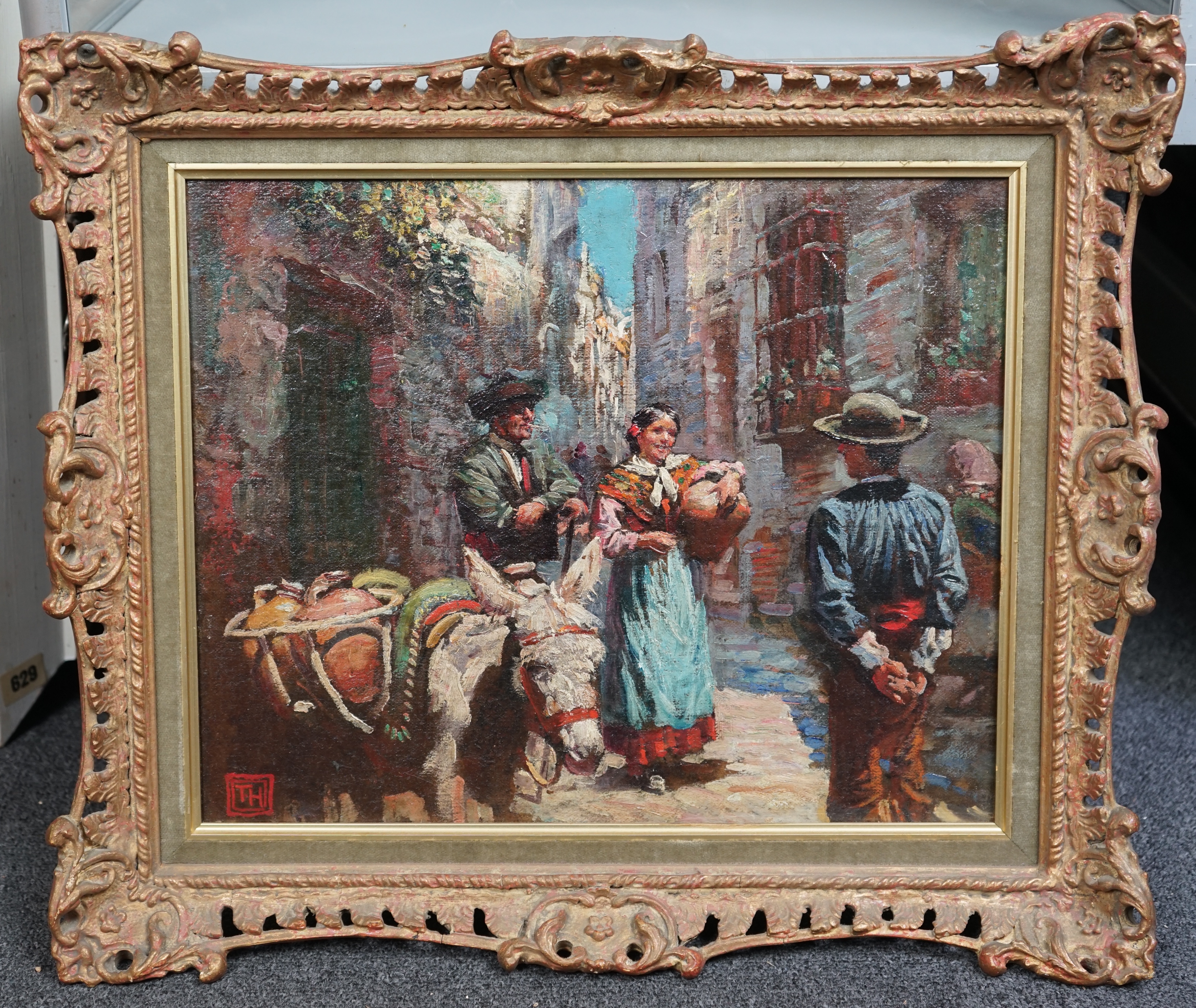 Arthur Trevor Haddon (British, 1864-1941), Spanish street scene with figures and donkey, oil on canvas board, 32 x 40cm